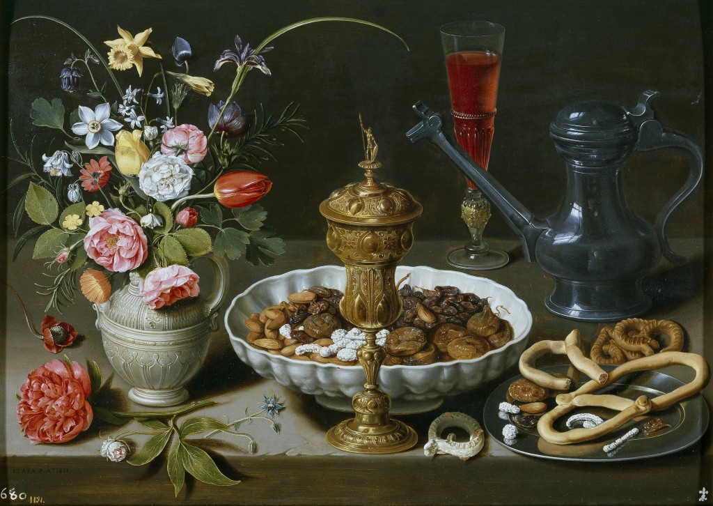 Clara Peeters. Bodegón con flores, copa de plata dorada, almendras, frutos secos, dulces, panecillos, vino y jarra de peltre, 1611. Museo Nacional del Prado