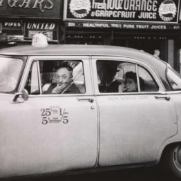 Diane Arbus. axicab driver at the wheel with two passengers, N.Y.C. 1956 © The Estate of Diane Arbus, LLC
