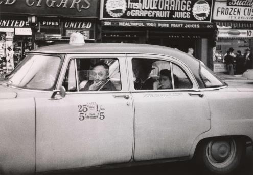 Diane Arbus. Taxicab driver at the wheel with two passengers, N.Y.C. 1956 © The Estate of Diane Arbus, LLC